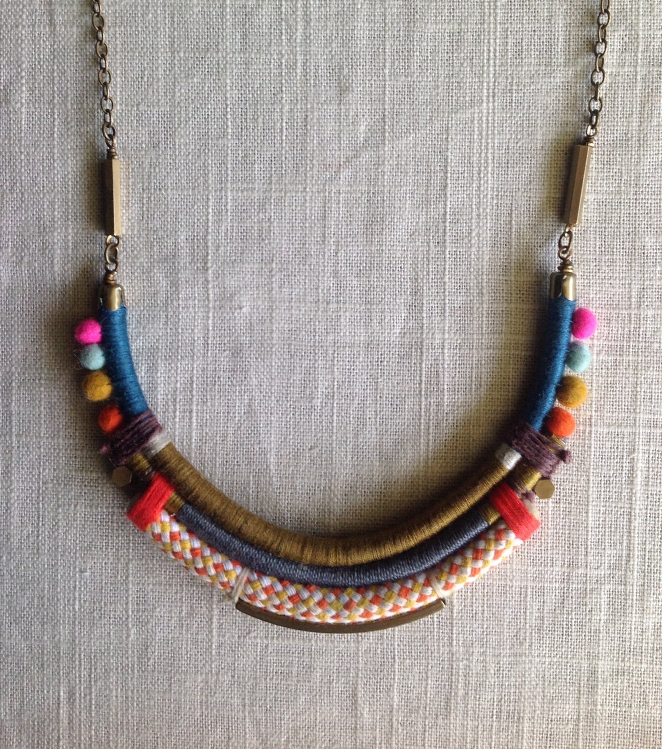 The ISADORA Necklace- Color Study No. 34- Statement Necklace-Fiber Wrapped Leather, Hand Felted Wool Pom Poms, And Raw Brass