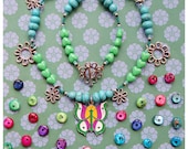 Colorful butterfly and flowers princess necklace for little girl in baby blue, emerald green, purple and silver colours