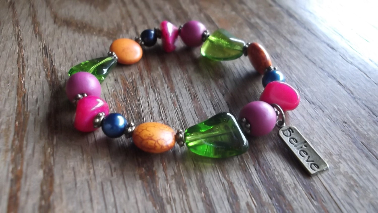 Earthy Boho Beaded Multicolor Stretch Bracelet: Glass, Howlite stone, and Wood beads Purple, Orange, Fuschia Blue,"Believe" and green