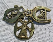 Collection of Vintage Horse Medals or Horse Brasses with Windmill, Rampant Lion, and Walking Horse