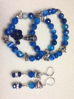 Two Blue Agate stretchy bracelets, Silver Skull and daggar spacers, metal rose and swarovski crystal drops.