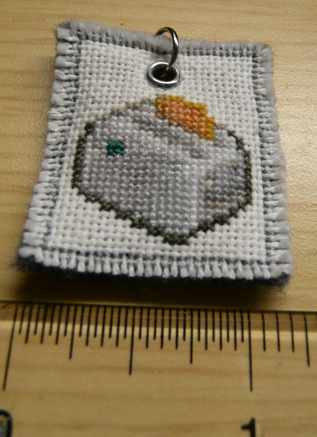 Toaster with toast cross stitched pendant
