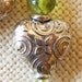 Silver Heart Earrings touched with Peridot