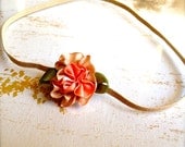 Baby mini peach tan flower headband on skinny elastic. Photo prop. Flower girl, baby girl, newborn. Available in ten colors.