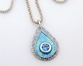 Silver and Enamel Sparkling Turquoise Swirl Teardrop Pendant. Handmade gem set with a Zircon CZ on sterling silver chain.