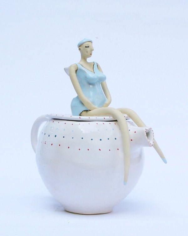 Beautiful old swimmer on teapot with polka dot