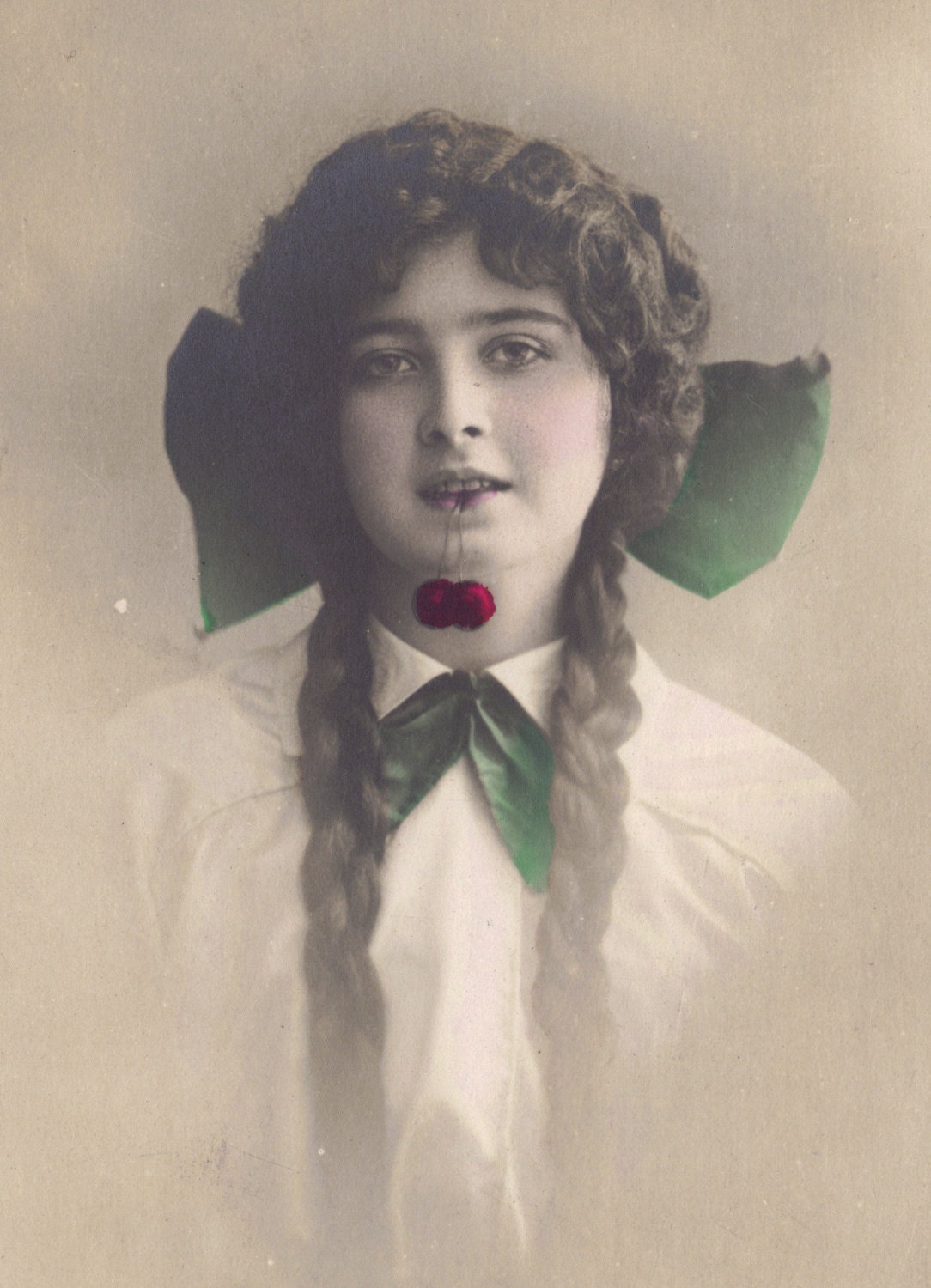 Young Lady Dangling Cherries From Her Mouth, circa 1910s