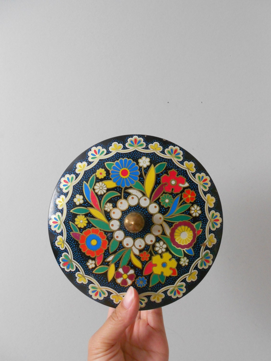 vintage DAHER metal tin with footed pedestal / knob / yellow blue