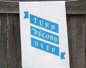Kitchen Towel "Turn That Record Over" banner print in peacock blue ink on white towel