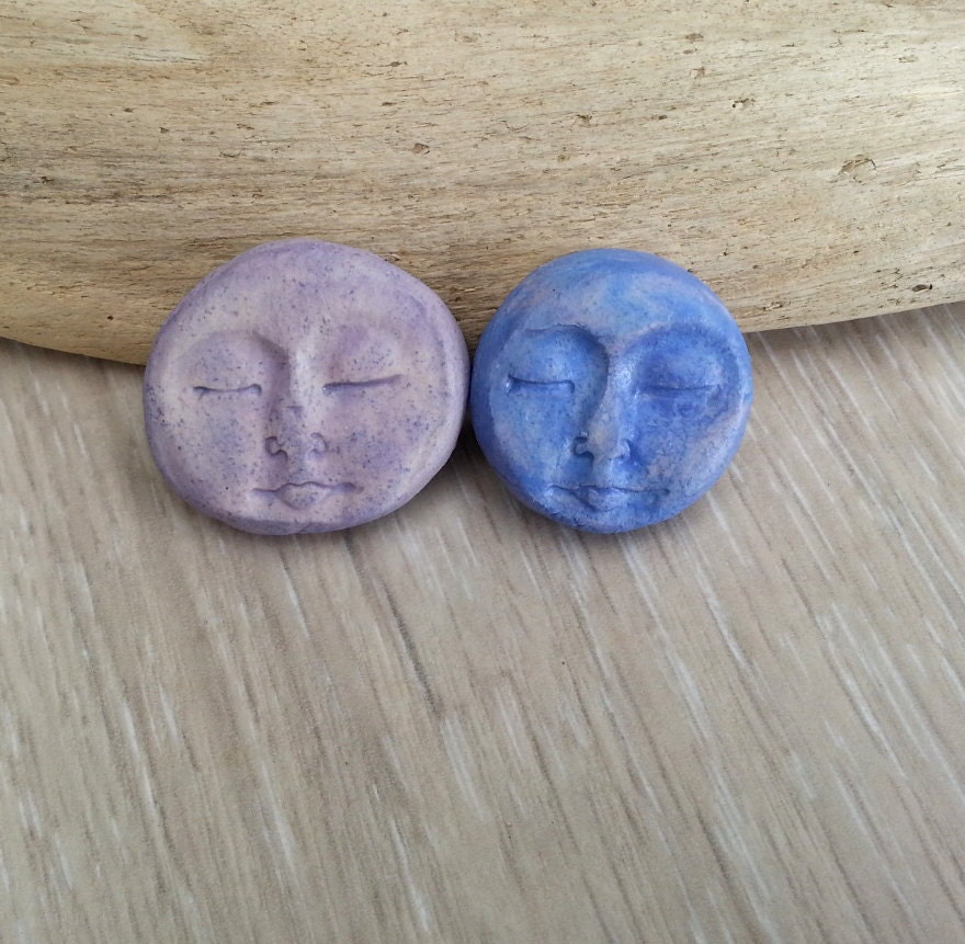 Two ceramic  face cabs in purple  art beads