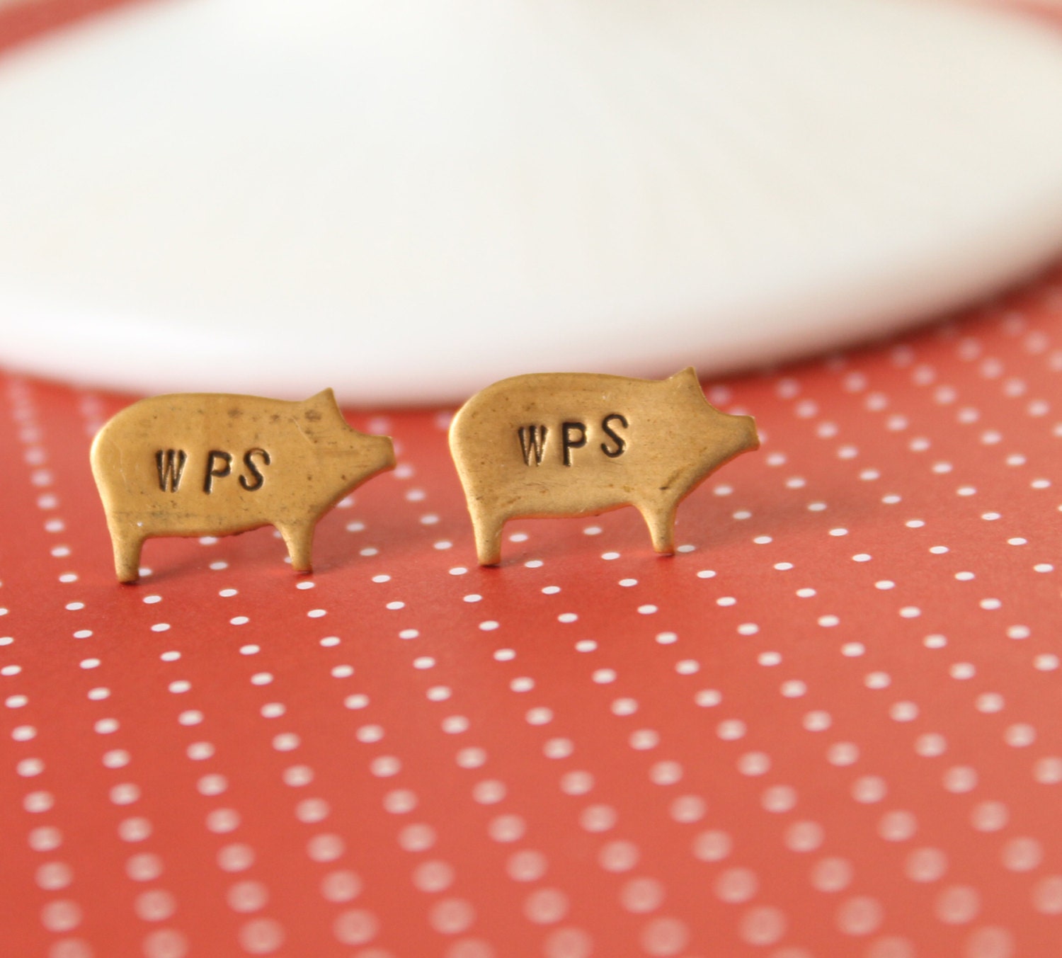 Brass Razorback stud earrings. WPS