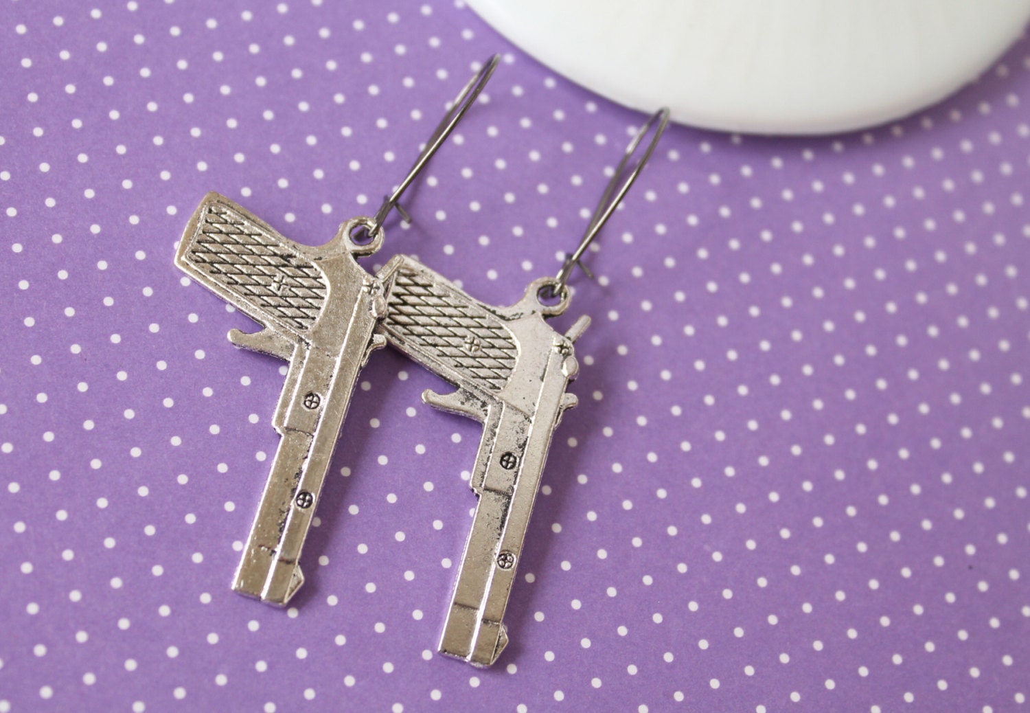 Shiny silver gun earrings