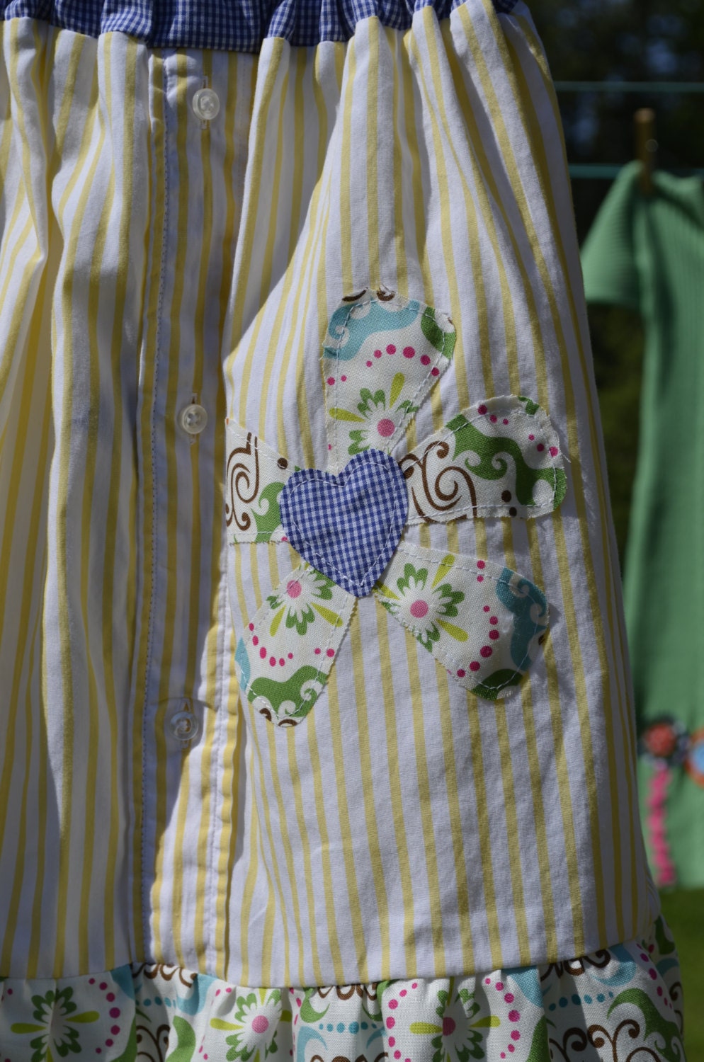 Yellow striped skirt with flower applique and flutter ruffle, girls size 10-12