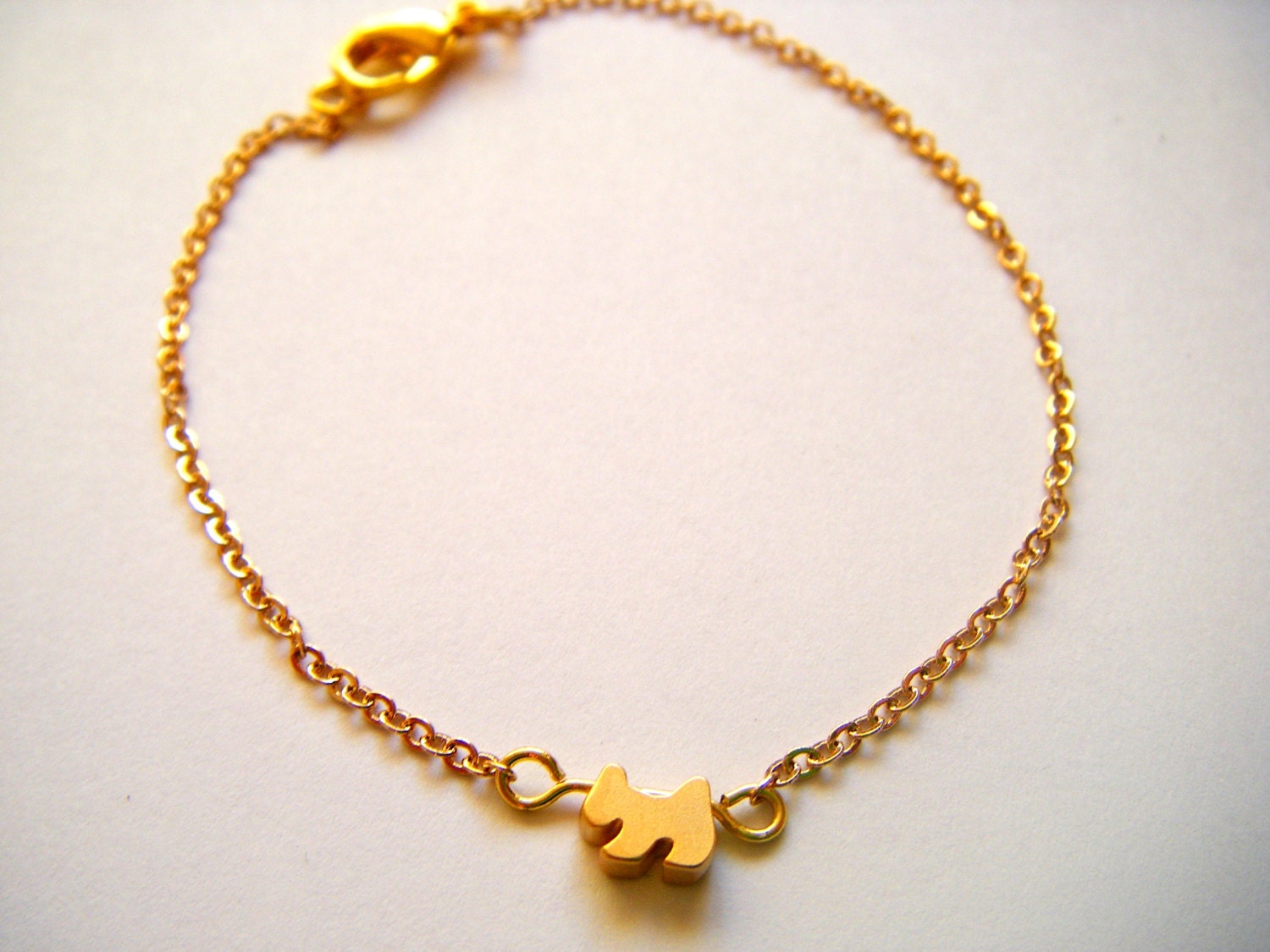 Tiny puppy charm bracelet - 16k gold platedon fine gold plated chain - modern minimalist jewelry
