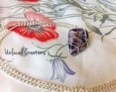 audrina. a wire wrapped banded amethyst necklace.