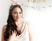adorable 50s bridal hair clip with birdcage veil