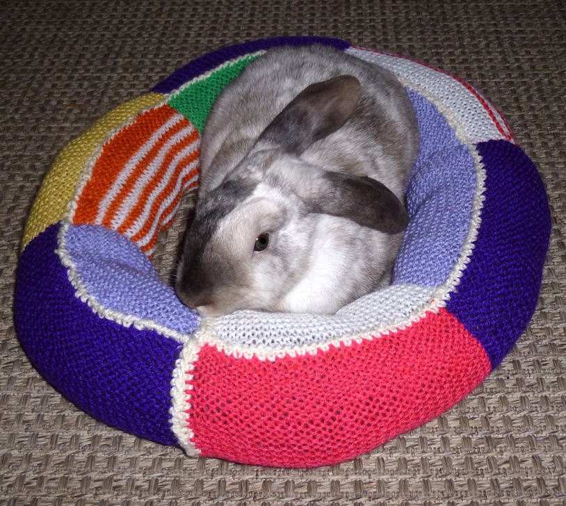 Ugli Donut bunny rabbit bed for a small to medium sized bunny hand knit pink white and purple