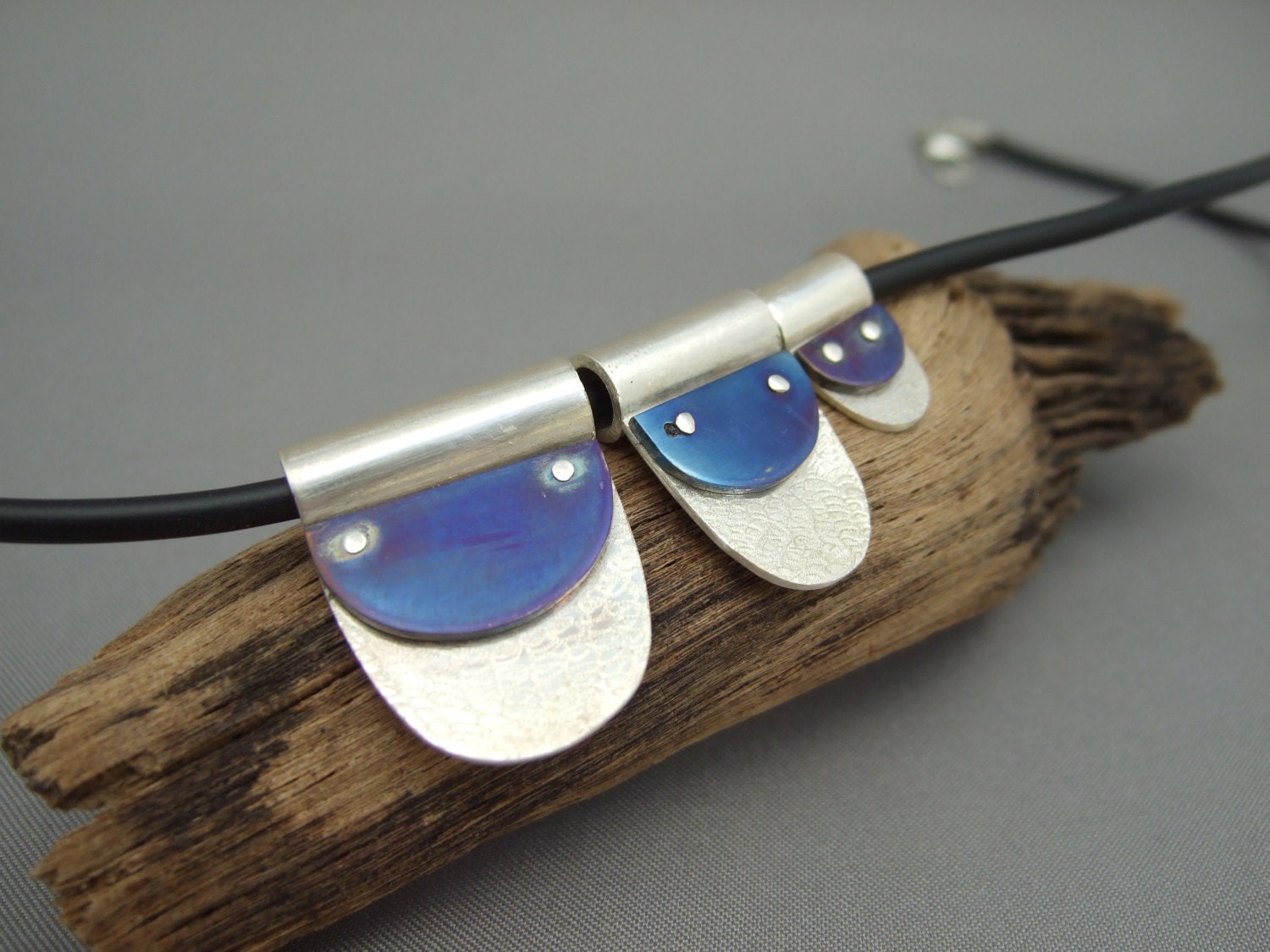 Blue Titanium and Sterling Silver Pendant Trio. A triad of silvery blue waves.
