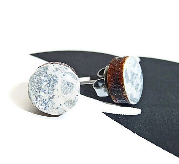 Round wooden stud post earrings white icing silver glitter and silver shimmer asymmetrical design