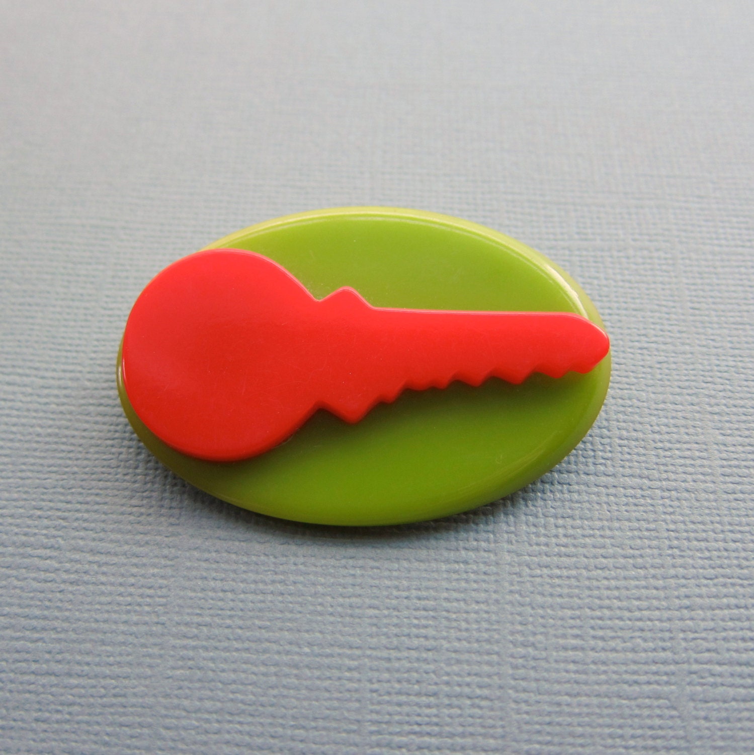 Vintage Bakelite Brooch. cherry red and olive key silhouette pin