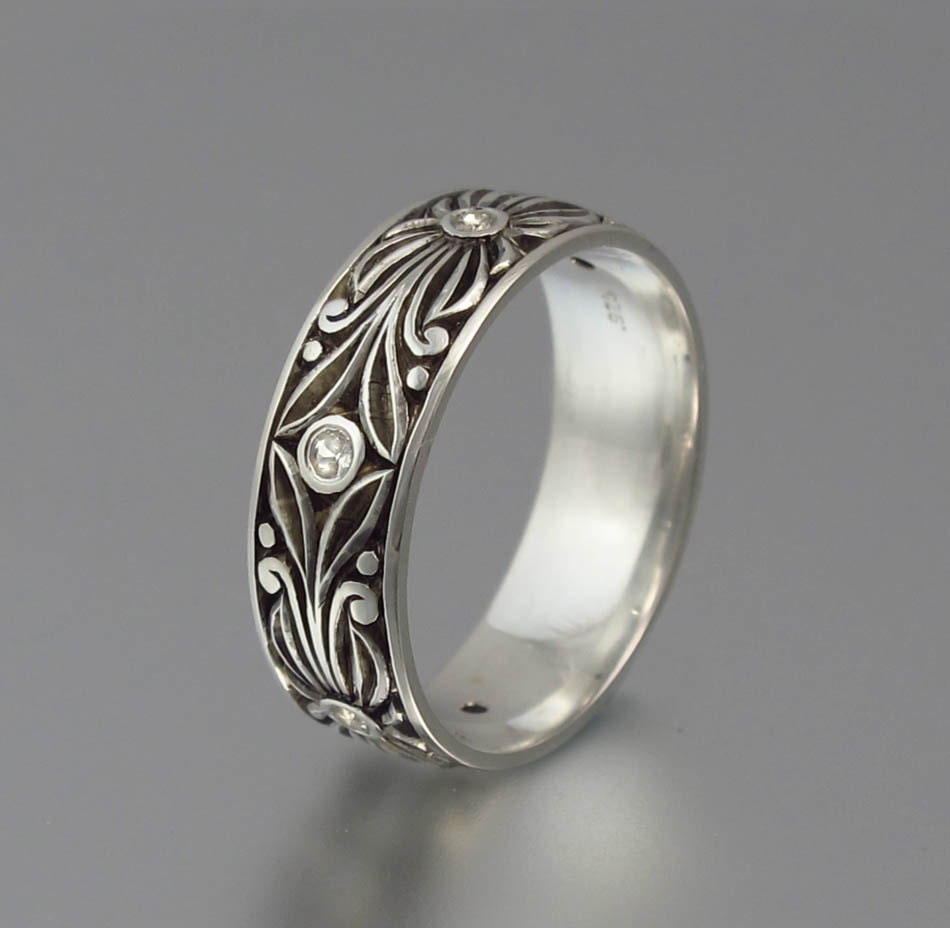 The WHITE COUNT silver and white sapphires wedding band