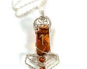 Amber Mjölnir carved with Tiwaz