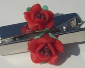 set of 2 hair clips with red polymer clay flower embellishments
