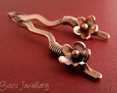Antiqued copper earrings with a hammered squiggle wire wrapped with a copper flower