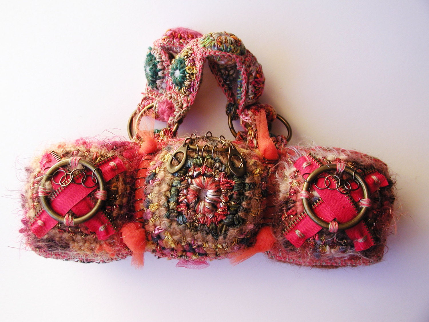CaterPillaR MiniBag: made with mixed materials (new & upcycled), multicolor in red, with bronze metal ornaments, tulle and satin decorations