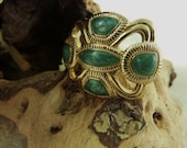Button Ring  Gold,  5 Green Swirls stones, Adjustable