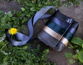 Purse handbag made from reclaimed seatbelts.