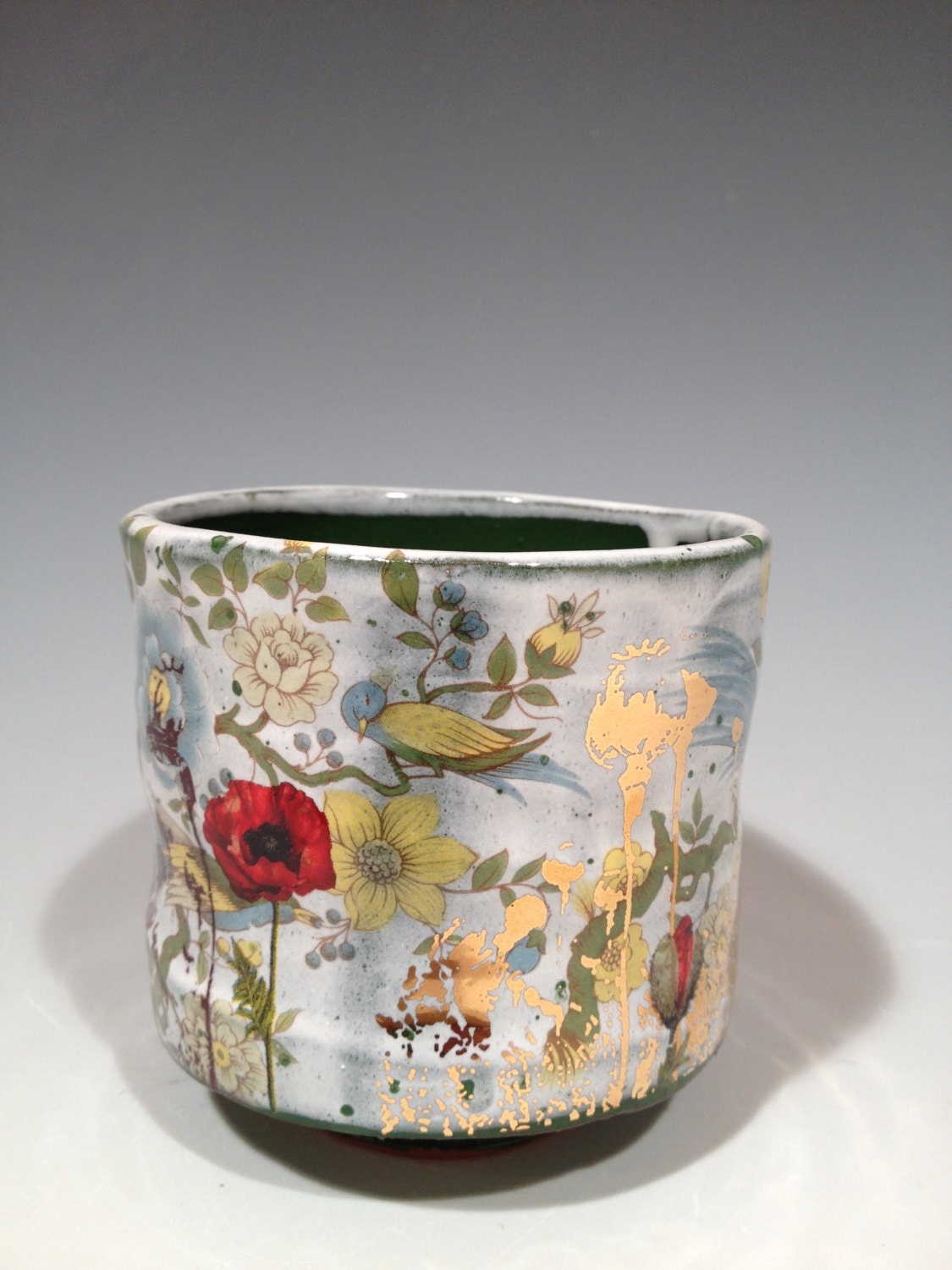 Cup with green and white glaze,  poppies, and gold decals