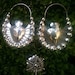 Frida Style silver hoops with a milagro heart in the middle