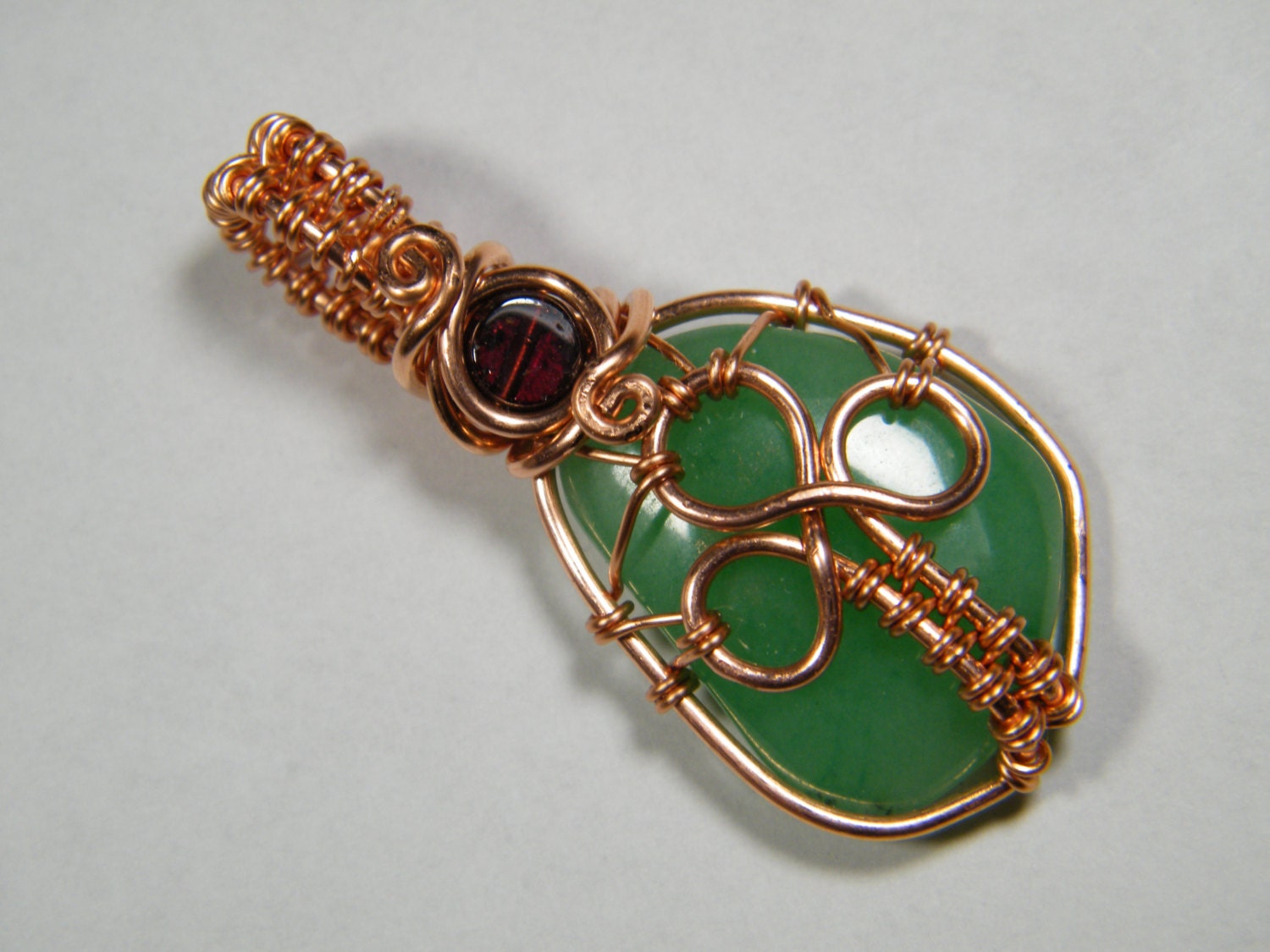 Woven wire wrapped Green Quartz with Garnet Shamrock pendant