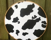 Custom Hand Embroidered hoop art. Cow Print. 10"