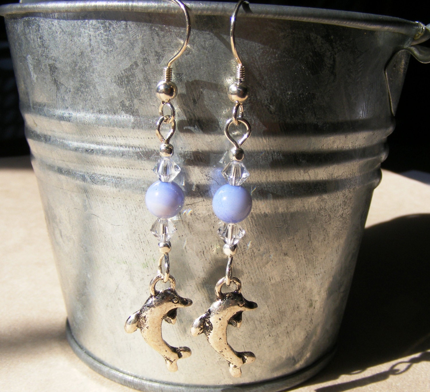 Light sapphire and swarovski crystal dolphin earrings