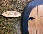 Miniature rustic engraved wooden family name sign for fairy gnome dwellings.