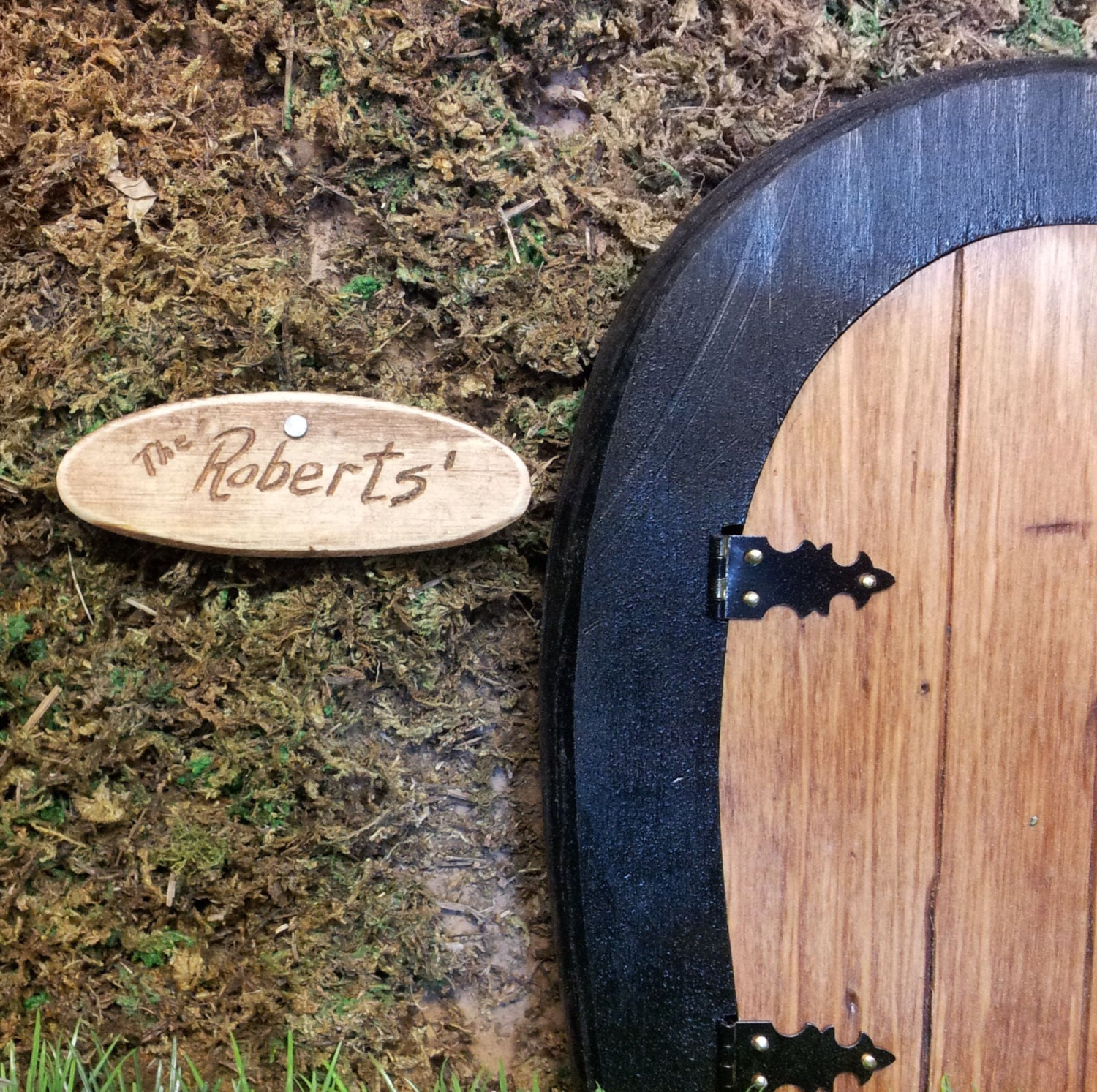 Miniature rustic engraved wooden family name sign for fairy gnome dwellings.