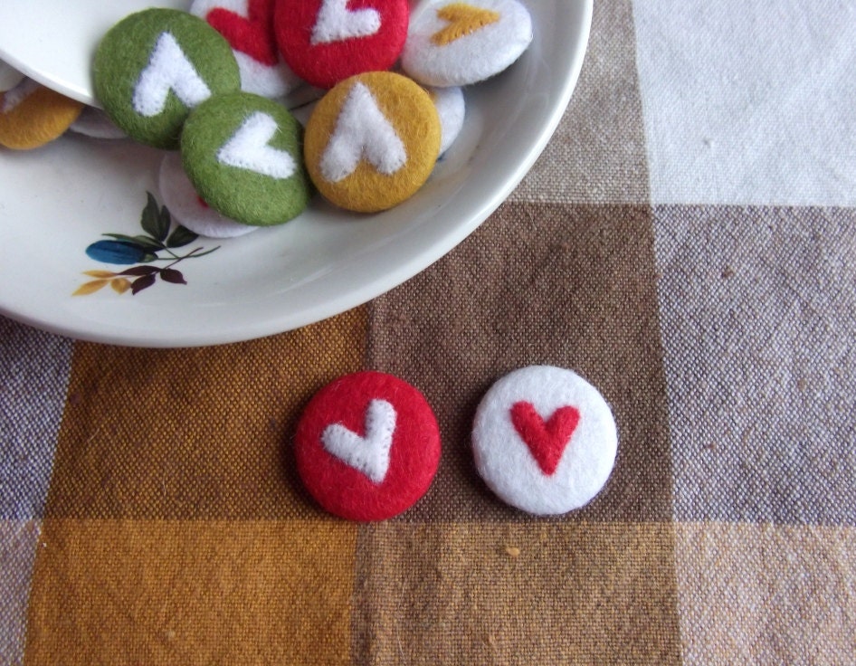 red and white felt heart badges