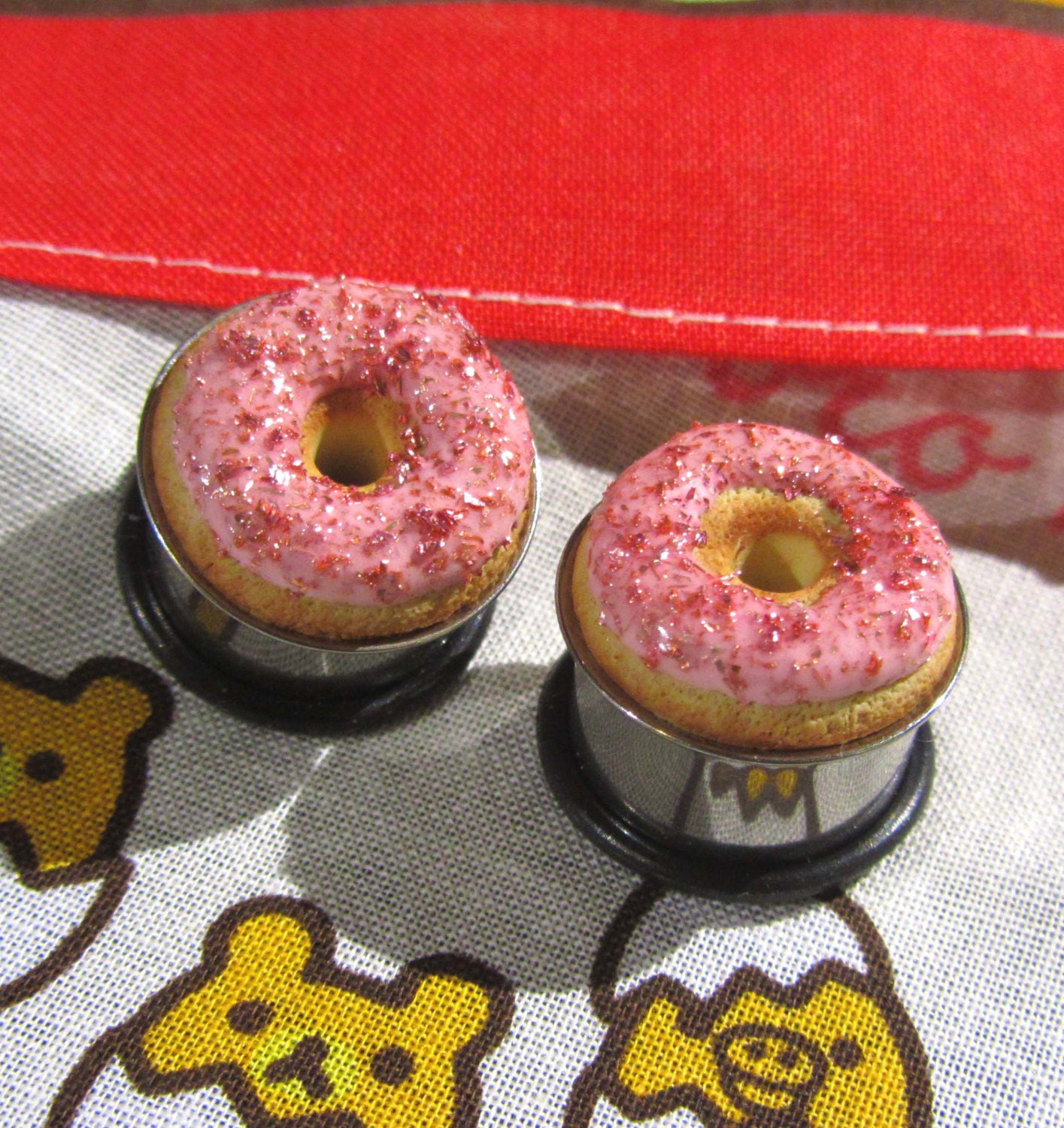 5/8" Donut Eyelets - Pixiedust Donut Plugs in Red on Pink