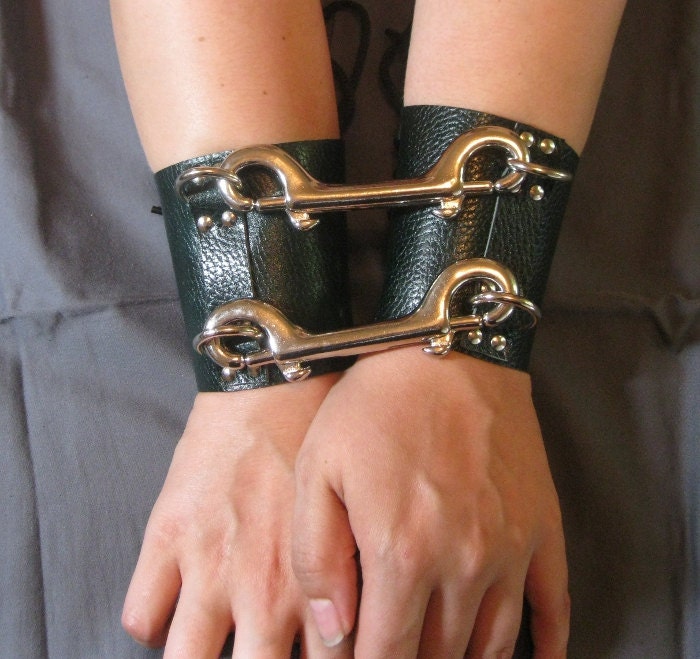 Green "lizard skin" leather and steel bondage handcuffs