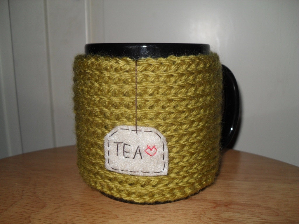 knitted tea mug cozy cup cozy in pea green with hand embroidered hanging tea patch with red heart