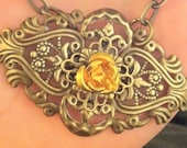 19' Antique Brass Filigree necklace with a gold aluminum rose Cabochon