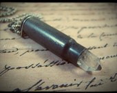 Bullet shell and quartz crystal necklace. Upcycled, found object, post-apocalyptic jewelry. Free US shipping.