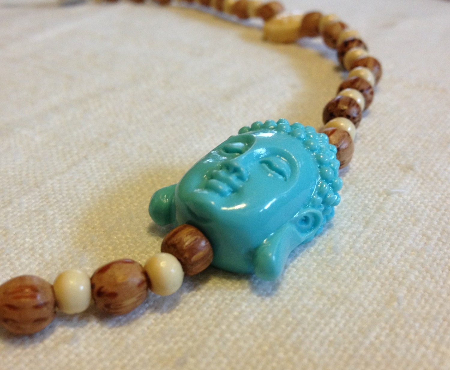 Turquoise Buddha and wood beaded necklace