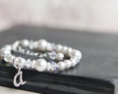 Baby bracelet with an initial ....white baby flower girl communion baptism christening  pearl and crystal girl toddler child bracelet