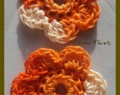 2 lovely crochet flowers in verigated orange and white