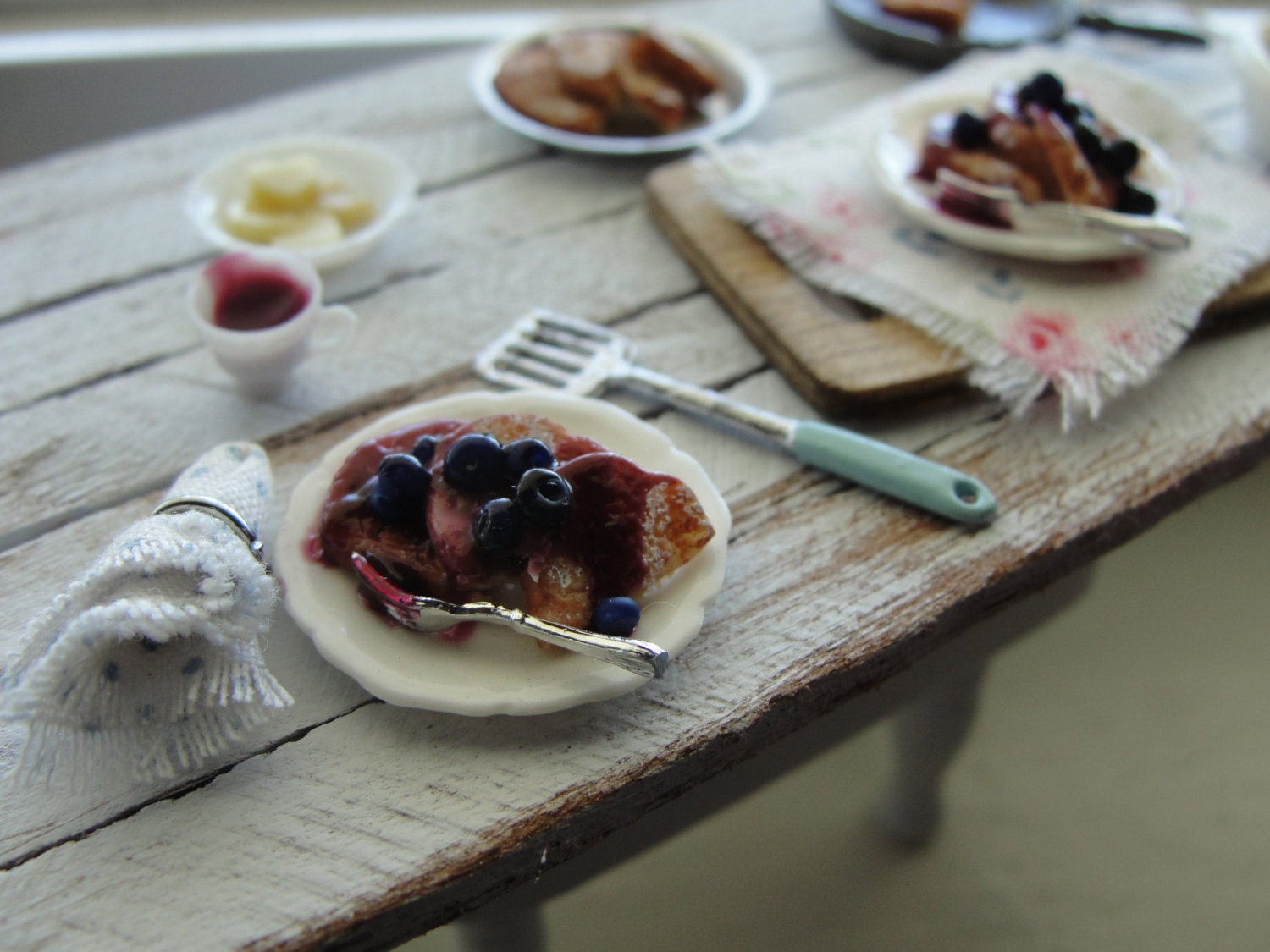 Miniature making blueberry french toast