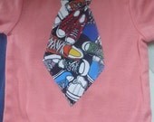 Salmon colored bodysuit (Onesie) with sneakers tie for your little gentleman size 9-12 mos.