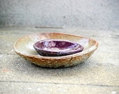 Ceramic serving bowls in moss and purple